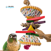 Colorful handmade Chew N’ Play bird toy with palm leaf, wood blocks, and cupcake liners for small parrots like budgies and cockatiels