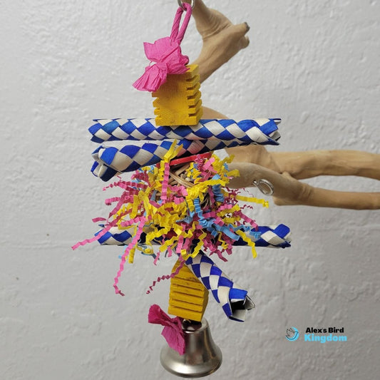 Small bird toy with finger traps, crinkle shred, balsa blocks, and a bell, designed for cockatiels, lovebirds, and parrotlets